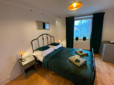 Łóżko lub łóżka w pokoju w obiekcie Apartament Kamienica