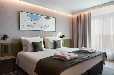 Łóżko lub łóżka w pokoju w obiekcie Q Hotel Plus Wrocław Bielany