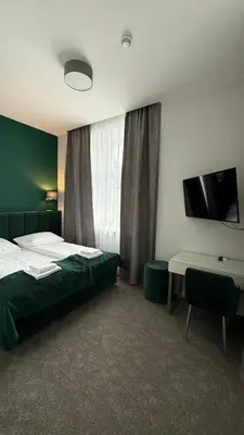 Łóżko lub łóżka w pokoju w obiekcie Stara Biblioteka