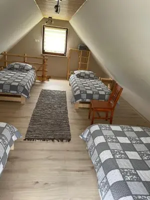 Łóżko lub łóżka w pokoju w obiekcie Świerkowy Zakatek