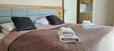 Łóżko lub łóżka w pokoju w obiekcie Aparthotel Apartamenty Czarna Góra 234