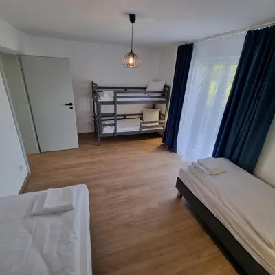 Łóżko lub łóżka w pokoju w obiekcie Apartamenty Boczna 3B z sauną i balią