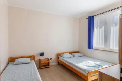 Łóżko lub łóżka w pokoju w obiekcie Apartamenty Stołowe