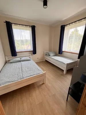 Łóżko lub łóżka w pokoju w obiekcie Apartamenty Stołowe