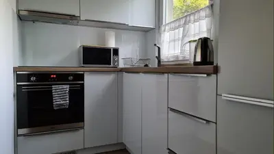 Kuchnia lub aneks kuchenny w obiekcie Spokojny Wypoczynek 5