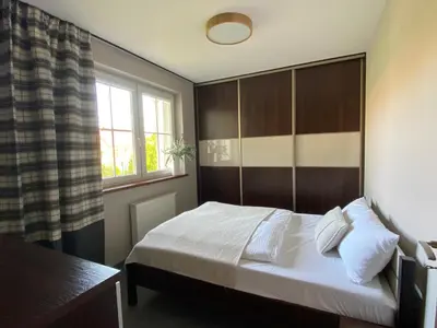 Łóżko lub łóżka w pokoju w obiekcie Apartament Caminski Dębowa