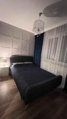 Łóżko lub łóżka w pokoju w obiekcie Luksusowy zakątek