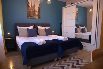 Łóżko lub łóżka w pokoju w obiekcie Sleep In Apartament Centrum
