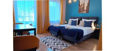 Łóżko lub łóżka w pokoju w obiekcie Sleep In Apartament Centrum