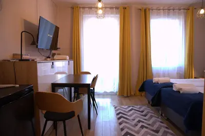 Łóżko lub łóżka w pokoju w obiekcie Sleep In Apartament Centrum