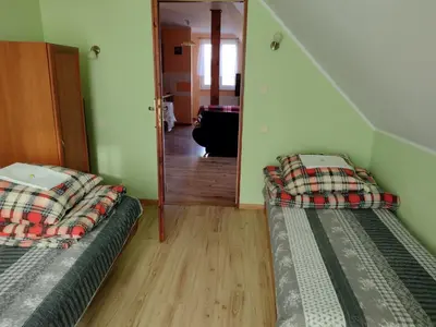 Łóżko lub łóżka w pokoju w obiekcie Czerwona Woda