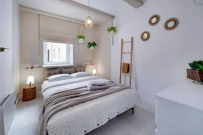 Łóżko lub łóżka w pokoju w obiekcie CZAS NA GÓRY Jedlina-Zdrój. Apartament na 5