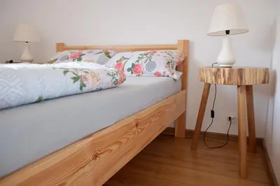 Łóżko lub łóżka w pokoju w obiekcie Maślany Domek