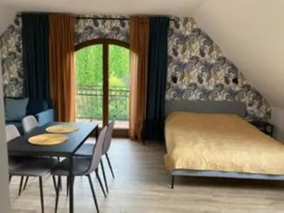 Łóżko lub łóżka w pokoju w obiekcie Apartamenty Brzozowe Zacisze