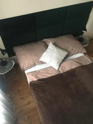 Łóżko lub łóżka w pokoju w obiekcie Apartament M