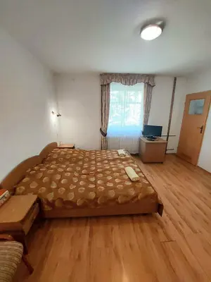 Łóżko lub łóżka w pokoju w obiekcie Marel-Apartments U SOWY- Park- Polanica Zdrój