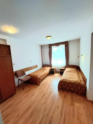 Łóżko lub łóżka w pokoju w obiekcie Marel-Apartments U SOWY- Park- Polanica Zdrój