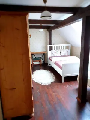 Łóżko lub łóżka w pokoju w obiekcie Dom Czarnów 6