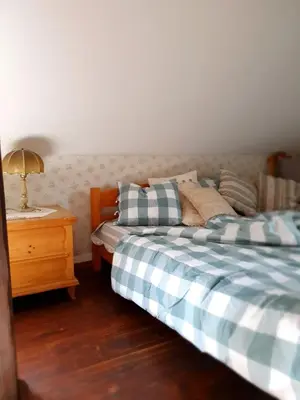 Łóżko lub łóżka w pokoju w obiekcie Dom Czarnów 6