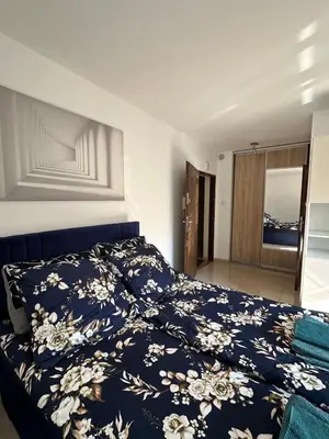 Łóżko lub łóżka w pokoju w obiekcie Apartament Rodo