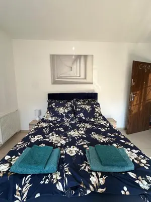 Łóżko lub łóżka w pokoju w obiekcie Apartament Rodo