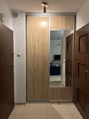Łóżko lub łóżka w pokoju w obiekcie Apartament Rodo