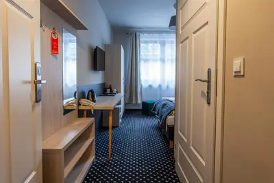 Łóżko lub łóżka w pokoju w obiekcie Medical Wellness & SPA Werona