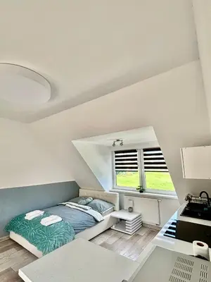 Łóżko lub łóżka w pokoju w obiekcie Apartamenty Zdrój