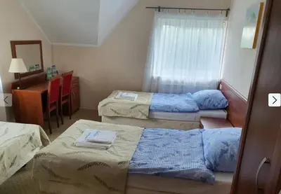 Łóżko lub łóżka w pokoju w obiekcie Ośrodek ANKAR