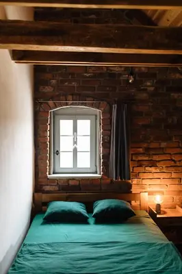 Łóżko lub łóżka w pokoju w obiekcie Potasznia 31