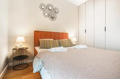 Łóżko lub łóżka w pokoju w obiekcie Komfortowy apartament z balkonem i parkingiem