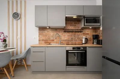 Kuchnia lub aneks kuchenny w obiekcie Apartment Kamienna Krzyki with FREE GARAGE Wrocław by Noclegi Renters