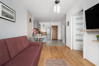 Telewizja i/lub zestaw kina domowego w obiekcie Apartment Kamienna Krzyki with FREE GARAGE Wrocław by Noclegi Renters