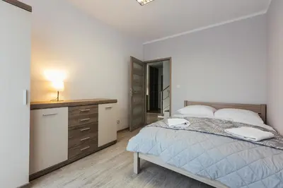 Łóżko lub łóżka w pokoju w obiekcie Dom Zakątek, Kudowa Zdrój
