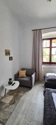 Łóżko lub łóżka w pokoju w obiekcie SUKIENNICE MIĘDZYLESIE