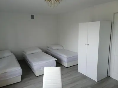 Łóżko lub łóżka w pokoju w obiekcie Manhattan