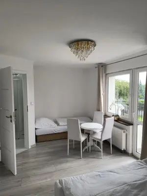 Łóżko lub łóżka w pokoju w obiekcie Manhattan