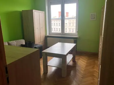 Łóżko lub łóżka w pokoju w obiekcie Blue River - Plac Legionow