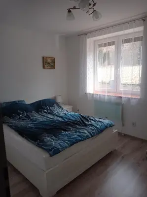 Łóżko lub łóżka w pokoju w obiekcie Sielankowy Domek