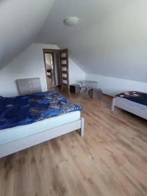 Łóżko lub łóżka w pokoju w obiekcie Sielankowy Domek