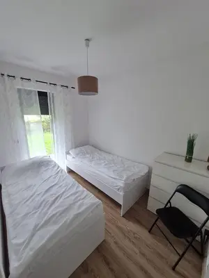 Łóżko lub łóżka w pokoju w obiekcie Apartamenty Josef