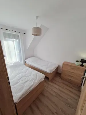 Łóżko lub łóżka w pokoju w obiekcie Apartamenty Josef