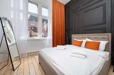 Łóżko lub łóżka w pokoju w obiekcie Apartament Malarska 50m od Rynku
