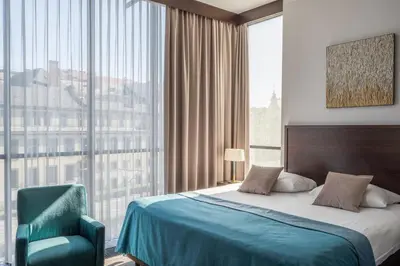 Łóżko lub łóżka w pokoju w obiekcie Europeum Hotel