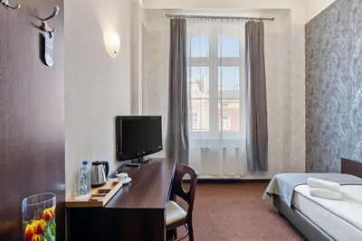 Łóżko lub łóżka w pokoju w obiekcie Hotel Diament Economy Gliwice