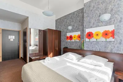 Łóżko lub łóżka w pokoju w obiekcie Hotel Diament Economy Gliwice