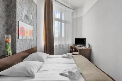Łóżko lub łóżka w pokoju w obiekcie Hotel Diament Economy Gliwice