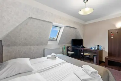 Łóżko lub łóżka w pokoju w obiekcie Hotel Diament Economy Gliwice