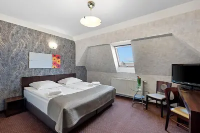 Łóżko lub łóżka w pokoju w obiekcie Hotel Diament Economy Gliwice