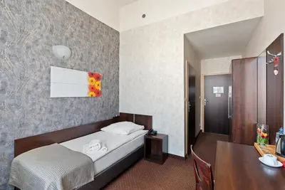 Łóżko lub łóżka w pokoju w obiekcie Hotel Diament Economy Gliwice